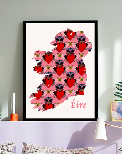 Framed artwork of a map of Ireland with  Claddagh hearts and 'Eire' text on a wall.